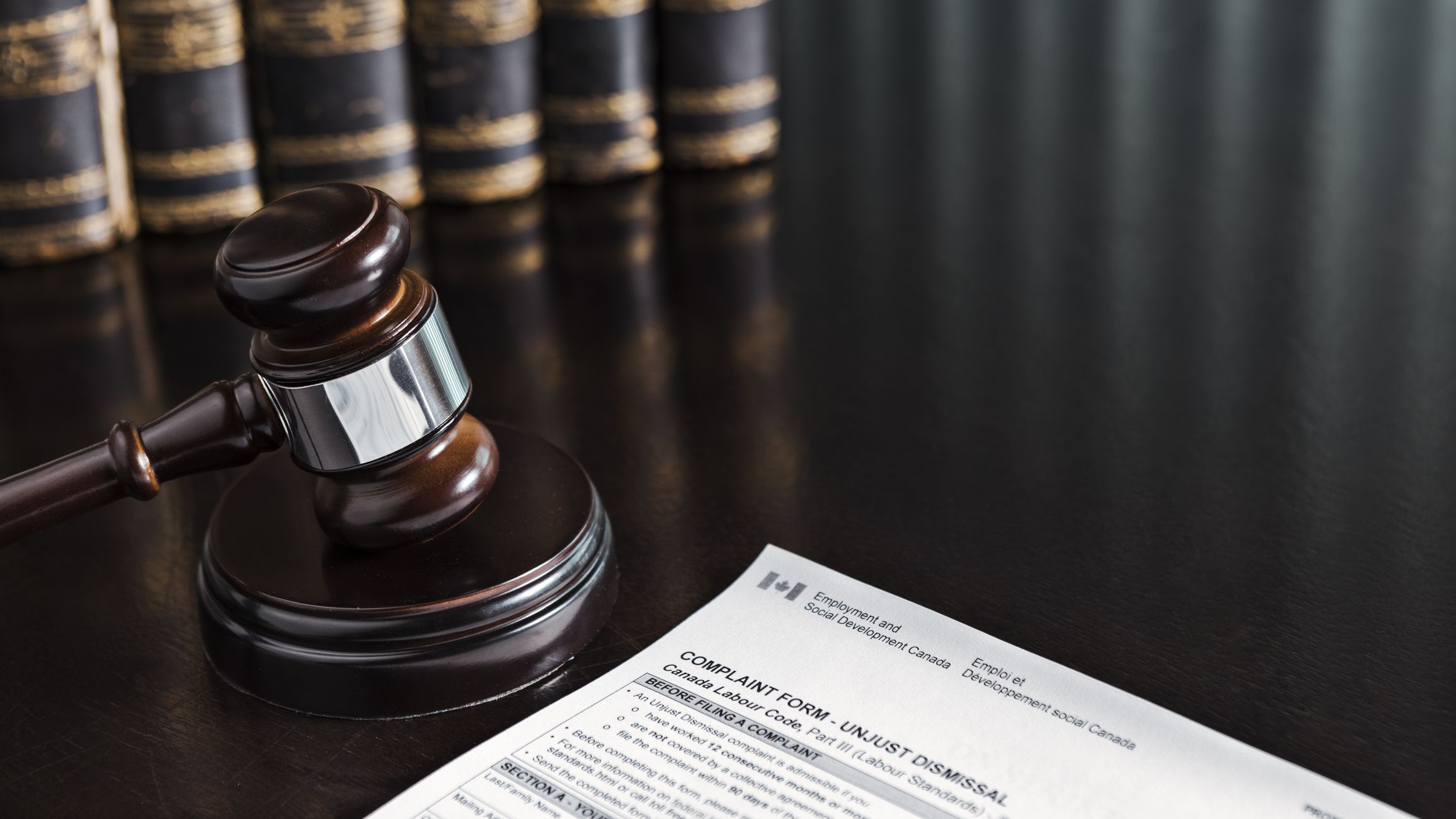 Canada Unfair Dismissal Form with Gavel and Books